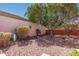 Private backyard featuring decorative rocks, mature trees, a statue, and ample space for outdoor enjoyment at 2101 S Meridian Rd # 60, Apache Junction, AZ 85120