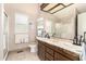 Bathroom featuring double sinks, vanity, and a tiled floor with unique patterns at 2101 S Meridian Rd # 60, Apache Junction, AZ 85120