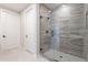 Bathroom showcasing a glass shower door and stone tile at 2121 W Sonoran Desert Dr # 47, Phoenix, AZ 85085