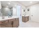 Elegant bathroom with double vanity, modern fixtures, large mirrors, and a spacious walk-in shower at 2121 W Sonoran Desert Dr # 47, Phoenix, AZ 85085