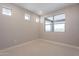 Bright bedroom with carpet, natural light, and multiple windows at 2121 W Sonoran Desert Dr # 47, Phoenix, AZ 85085