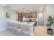 Bright kitchen with modern appliances, wooden cabinets, a large island with bar seating, and stylish decor at 2121 W Sonoran Desert Dr # 47, Phoenix, AZ 85085