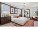 Stylish main bedroom with white linens, neutral decor, bedside tables, and a decorative rug at 21236 N 58Th St, Phoenix, AZ 85054