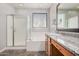 This bathroom features a shower, bathtub, granite countertop and decorative window at 2242 W Calle Marita --, Phoenix, AZ 85085