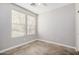 This bedroom features a ceiling fan, window with blinds, and neutral paint at 2242 W Calle Marita --, Phoenix, AZ 85085