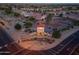 Aerial view of the community entrance and surrounding homes in a well-maintained neighborhood at 2369 E Fiesta Dr, Casa Grande, AZ 85194