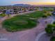 Aerial shot of a golf course with green fairway and sand traps surrounded by homes and desert landscape at 2369 E Fiesta Dr, Casa Grande, AZ 85194