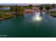 Scenic view of a pond with a fountain on a golf course in the residential community at 2369 E Fiesta Dr, Casa Grande, AZ 85194