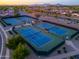 Aerial view of the community tennis courts with well-maintained blue courts and surrounding landscape at 2369 E Fiesta Dr, Casa Grande, AZ 85194