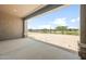 A covered patio with views of the golf course provides a peaceful outdoor living space at 26650 W Siesta Ln, Buckeye, AZ 85396
