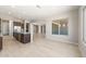 Open-concept kitchen boasts stainless steel appliances, granite countertops, and tile flooring at 26650 W Siesta Ln, Buckeye, AZ 85396