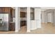 Modern kitchen with stainless steel appliances and granite countertops is ready for cooking and entertaining at 26650 W Siesta Ln, Buckeye, AZ 85396