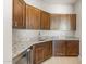 Updated kitchen featuring granite countertops, custom cabinets and a beverage center at 26650 W Siesta Ln, Buckeye, AZ 85396