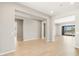 Open-concept living room offers ample space, tile floors, and access to outdoor views at 26650 W Siesta Ln, Buckeye, AZ 85396