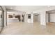 Bright and airy living room features tile flooring and an open concept design at 26650 W Siesta Ln, Buckeye, AZ 85396