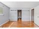 Bright living room with wood floors and grey walls with modern lighting fixtures above at 2700 E Allred Ave # B20, Mesa, AZ 85204