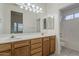 Bathroom featuring a double sink vanity with plenty of storage and a separate shower room at 2778 E Devon Ct, Gilbert, AZ 85296