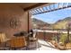 Relaxing patio featuring a dining table and chairs with mountain views, perfect for outdoor entertaining and enjoying scenic vistas at 36600 N Cave Creek Rd # 9B, Cave Creek, AZ 85331