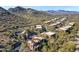 Aerial view of community featuring desert landscaping, pool, and beautiful mountain views at 36600 N Cave Creek Rd # 9B, Cave Creek, AZ 85331