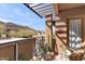 Secluded outdoor balcony with desert views, lounge seating, and potted plants at 36600 N Cave Creek Rd # 9B, Cave Creek, AZ 85331