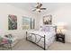 Cozy bedroom with neutral colors, a ceiling fan, and a scenic view from the window at 36600 N Cave Creek Rd # 9B, Cave Creek, AZ 85331