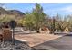 Welcoming community entrance featuring desert landscaping and stone accents at 36600 N Cave Creek Rd # 9B, Cave Creek, AZ 85331