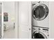 Convenient laundry area featuring a stackable washer and dryer unit at 36600 N Cave Creek Rd # 9B, Cave Creek, AZ 85331