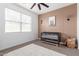 Cozy Bedroom with a crib, a patterned accent wall, and a large window at 36728 N Alderney Ct, San Tan Valley, AZ 85143