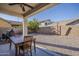 Backyard features an outdoor dining set and low maintenance gravel at 3816 E Phelps St, Gilbert, AZ 85295