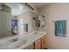 Bright bathroom features a double vanity and a large mirror at 3816 E Phelps St, Gilbert, AZ 85295