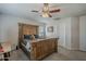 Bedroom featuring neutral walls, a ceiling fan, and an impressive wood-frame bed set at 3816 E Phelps St, Gilbert, AZ 85295