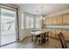 Bright dining area with natural light, tile flooring, and access to the outdoors through sliding glass doors at 3816 E Phelps St, Gilbert, AZ 85295