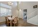 Dining room featuring tile floors, a large window, a chandelier, and tall ceilings at 3816 E Phelps St, Gilbert, AZ 85295