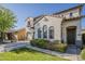 Attractive home exterior with a two-car garage, desert landscaping, and elegant arched windows at 3816 E Phelps St, Gilbert, AZ 85295