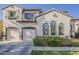 Inviting home exterior featuring a two-car garage, well-kept landscaping, and charming architectural details at 3816 E Phelps St, Gilbert, AZ 85295