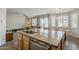 Open kitchen island flows seamlessly to the living area, offering a comfortable flow and modern stainless appliances at 3816 E Phelps St, Gilbert, AZ 85295