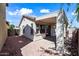 Inviting backyard featuring a covered patio and low-maintenance desert landscaping with rocks at 417 S 89Th Way, Mesa, AZ 85208