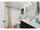 Bathroom featuring a shower-tub combo, vanity, and stylish light fixture at 417 S 89Th Way, Mesa, AZ 85208