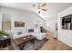 Spacious living room with vaulted ceiling, ceiling fans, and a view into the kitchen at 417 S 89Th Way, Mesa, AZ 85208