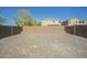 Gravel backyard enclosed with a block wall, providing a blank slate for customization at 4582 E Jadeite Dr, San Tan Valley, AZ 85143