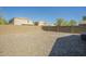 Gravel backyard with block wall and views of surrounding homes at 4582 E Jadeite Dr, San Tan Valley, AZ 85143