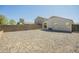 Gravel backyard enclosed with a block wall, offering privacy and low maintenance at 4582 E Jadeite Dr, San Tan Valley, AZ 85143