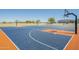 Community basketball court with blue flooring, orange accents, and hoops at 4582 E Jadeite Dr, San Tan Valley, AZ 85143