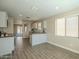 Bright kitchen with white cabinets, butcher block countertops, and wood-look tile flooring at 4582 E Jadeite Dr, San Tan Valley, AZ 85143