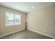 Office or spare bedroom with wood-look tile flooring and a large window offering natural light at 4582 E Jadeite Dr, San Tan Valley, AZ 85143