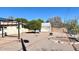 Spacious backyard with shade structure and fruit tree offers a relaxing outdoor area at 5533 E Decatur St, Mesa, AZ 85205