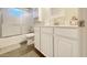 Clean, bright bathroom with a tub, a vanity, and storage solutions for a refreshing experience at 5533 E Decatur St, Mesa, AZ 85205