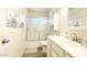 Clean, bright bathroom with a tub, a vanity, and storage solutions for a refreshing experience at 5533 E Decatur St, Mesa, AZ 85205