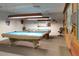 The billiards room features two pool tables with overhead lighting, providing a perfect space for friendly competition and recreation at 5533 E Decatur St, Mesa, AZ 85205