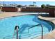 Enjoy swimming in this private in-ground pool with multiple access points and a spacious deck for relaxing and socializing at 5533 E Decatur St, Mesa, AZ 85205